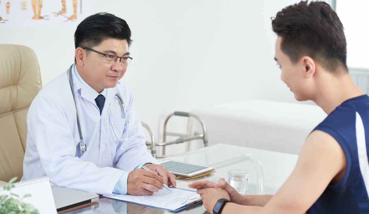 List of Tung Chung Clinics 2022 1 asian man consulting with doctor AUJN397
